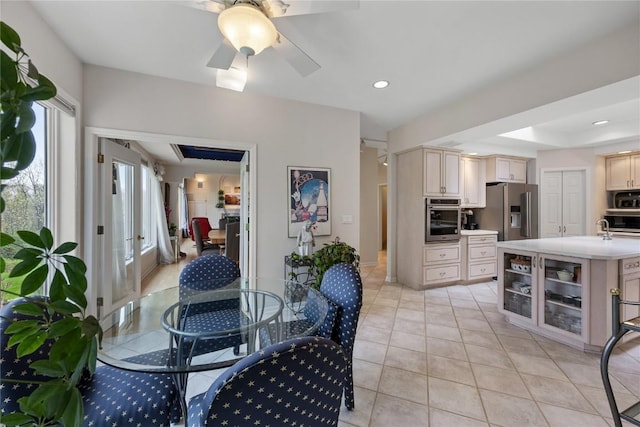 kitchen with light tile patterned floors, ceiling fan, light countertops, appliances with stainless steel finishes, and recessed lighting