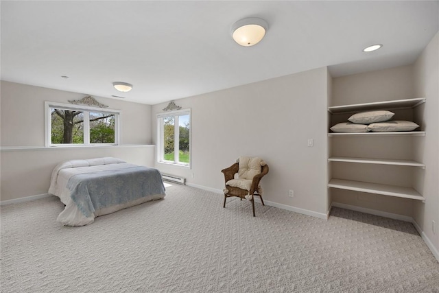 bedroom featuring carpet flooring, baseboards, and baseboard heating