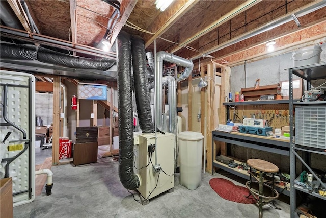 unfinished basement with a workshop area