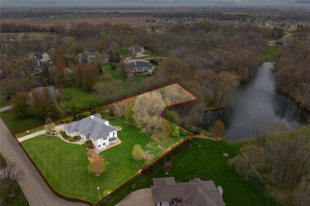 birds eye view of property featuring a water view