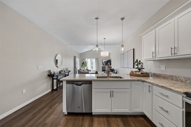 kitchen featuring a peninsula, lofted ceiling, dishwasher, ceiling fan, and white cabinetry