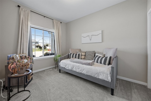 bedroom with carpet floors, baseboards, and visible vents