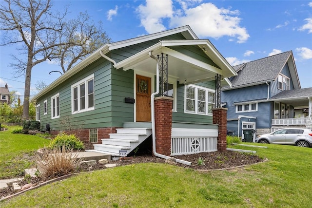 bungalow-style home featuring a front yard