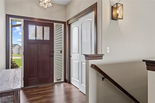 foyer entrance with dark wood finished floors