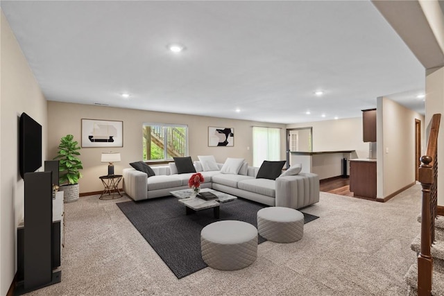 living area with carpet flooring, baseboards, and recessed lighting