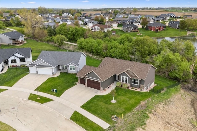 bird's eye view featuring a water view and a residential view