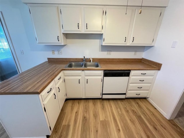 kitchen featuring light wood-style floors, white cabinets, a sink, and dishwasher