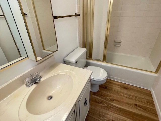 bathroom featuring vanity, toilet, shower / tub combination, and wood finished floors