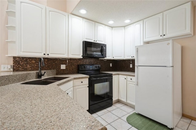 kitchen with light tile patterned floors, a sink, open shelves, black appliances, and tasteful backsplash