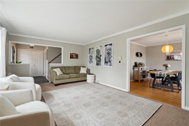 335 Parkland Dr SE, Cedar Rapids, IA 52403 - living area with crown molding, baseboards, and visible vents