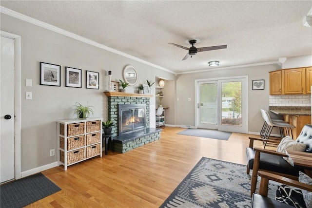 335 Parkland Dr SE, Cedar Rapids, IA 52403 - living area with light wood finished floors, a fireplace, and a textured ceiling