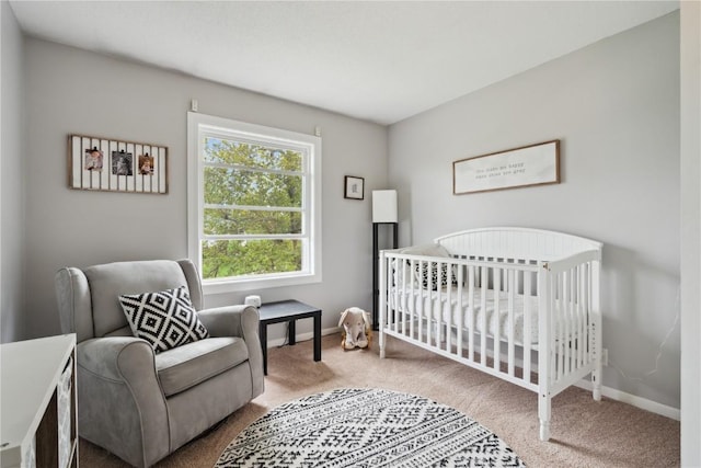 335 Parkland Dr SE, Cedar Rapids, IA 52403 - bedroom with carpet flooring, a nursery area, and baseboards