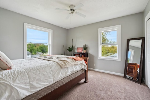 335 Parkland Dr SE, Cedar Rapids, IA 52403 - carpeted bedroom with baseboards and a ceiling fan