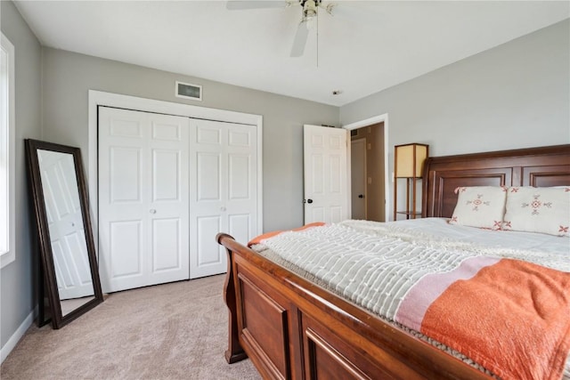 335 Parkland Dr SE, Cedar Rapids, IA 52403 - bedroom with a ceiling fan, a closet, visible vents, baseboards, and light carpet