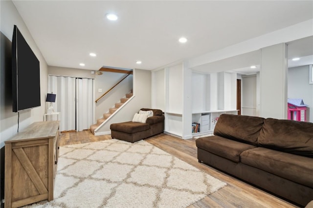 335 Parkland Dr SE, Cedar Rapids, IA 52403 - living area featuring stairway, wood finished floors, and recessed lighting