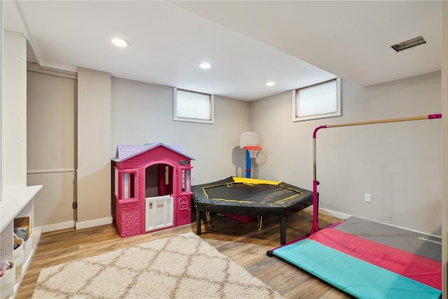 335 Parkland Dr SE, Cedar Rapids, IA 52403 - game room featuring wood finished floors, baseboards, and recessed lighting