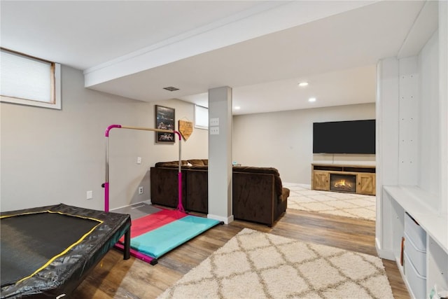 335 Parkland Dr SE, Cedar Rapids, IA 52403 - playroom featuring baseboards, visible vents, recessed lighting, and wood finished floors