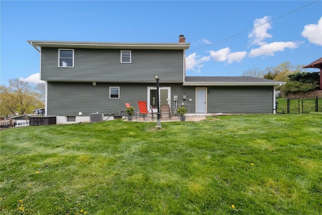 335 Parkland Dr SE, Cedar Rapids, IA 52403 - back of property featuring central AC unit, fence, a chimney, and a lawn