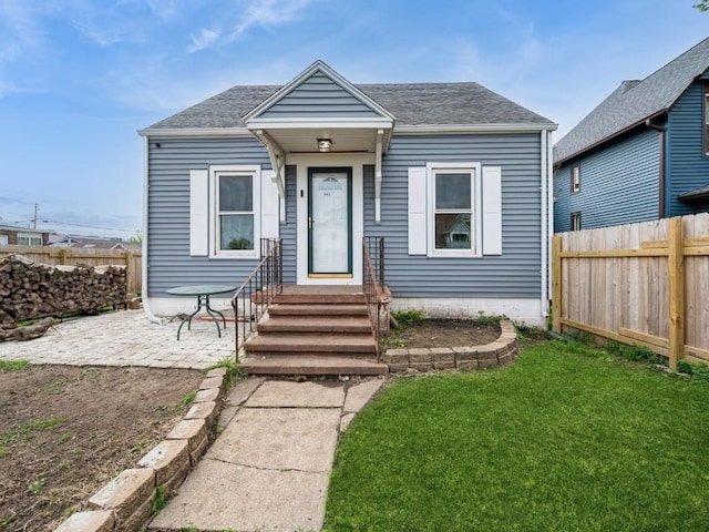 bungalow with a shingled roof