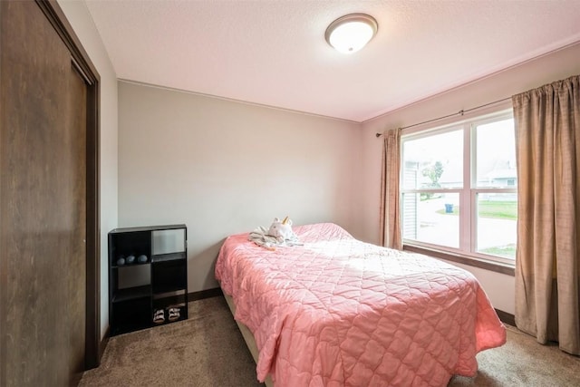 carpeted bedroom featuring a closet
