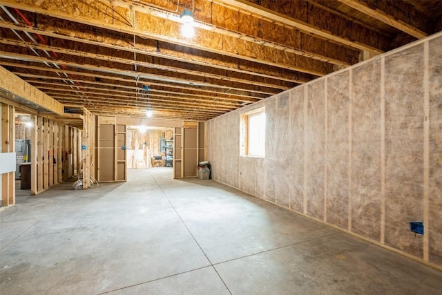 below grade area featuring electric water heater