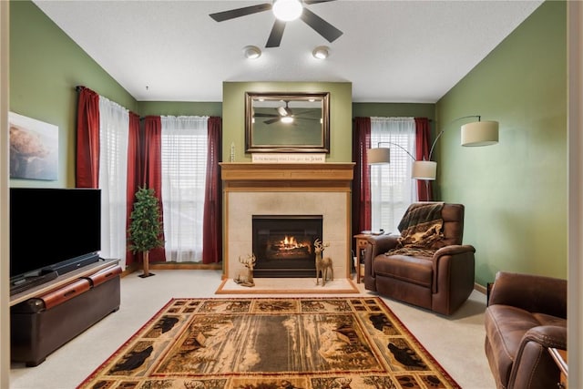 3110 Willowridge Rd Unit D, Marion, IA 52302 - living area with a ceiling fan, carpet, plenty of natural light, vaulted ceiling, and a fireplace