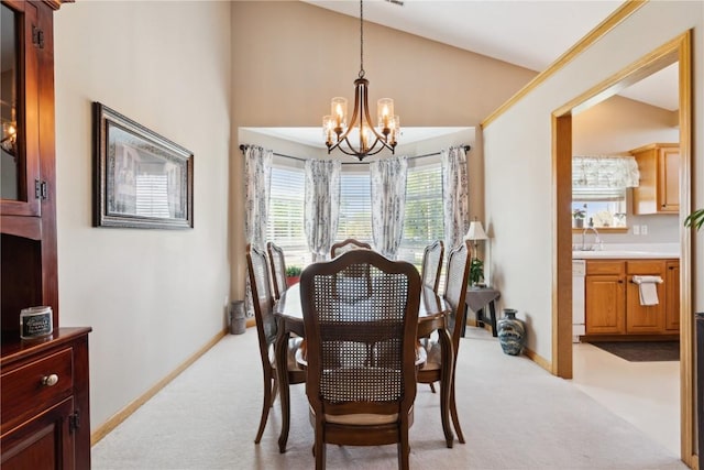 3110 Willowridge Rd Unit D, Marion, IA 52302 - dining space featuring a chandelier, light carpet, baseboards, and high vaulted ceiling