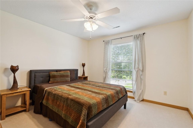 3110 Willowridge Rd Unit D, Marion, IA 52302 - bedroom with light colored carpet, baseboards, and a ceiling fan