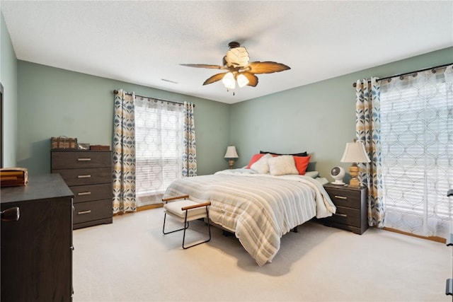 3110 Willowridge Rd Unit D, Marion, IA 52302 - bedroom featuring carpet floors and a ceiling fan