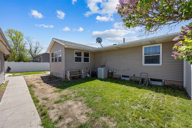 rear view of property featuring central AC unit