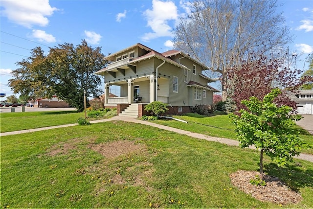 view of front of property featuring covered porch and a front yard
