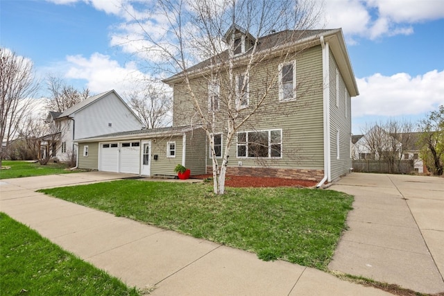 300 SW Palisades Rd, Mount Vernon, IA 52314 - view of front of home with driveway, an attached garage, and a front yard
