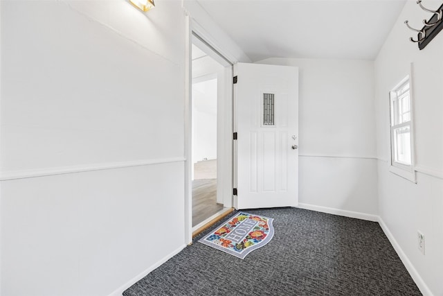 300 SW Palisades Rd, Mount Vernon, IA 52314 - doorway featuring carpet flooring and baseboards