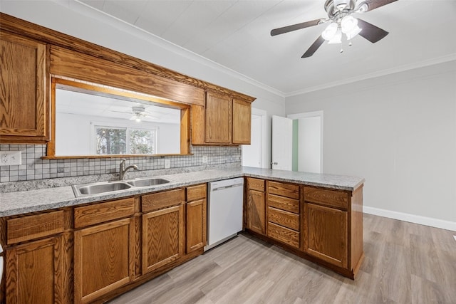 300 SW Palisades Rd, Mount Vernon, IA 52314 - kitchen featuring dishwasher, a sink, brown cabinetry, light wood-style floors, and crown molding