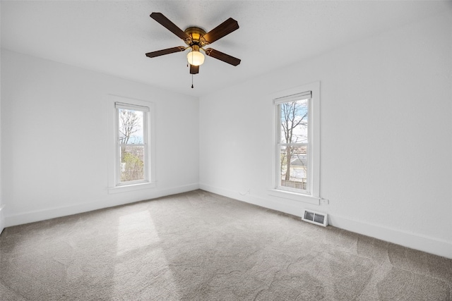 300 SW Palisades Rd, Mount Vernon, IA 52314 - spare room with carpet floors, baseboards, and a ceiling fan