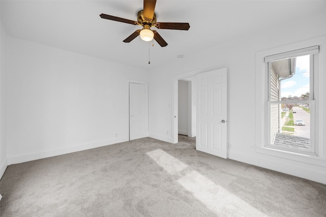 300 SW Palisades Rd, Mount Vernon, IA 52314 - unfurnished bedroom featuring carpet flooring, baseboards, and ceiling fan