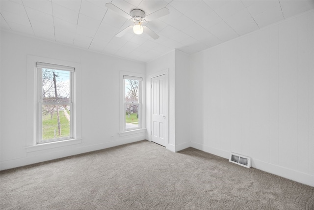 300 SW Palisades Rd, Mount Vernon, IA 52314 - spare room with carpet flooring, ceiling fan, and baseboards