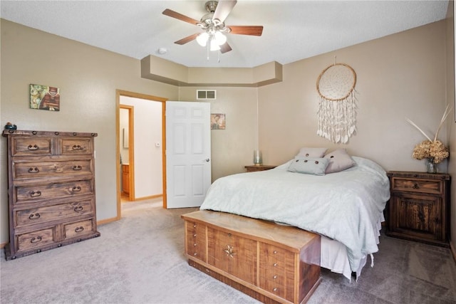 bedroom featuring carpet floors, baseboards, and a ceiling fan
