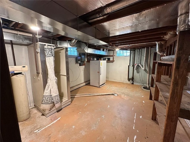 2770 24th Ave, Marion, IA 52302 - basement featuring freestanding refrigerator, a water softener, electric panel, and stairs