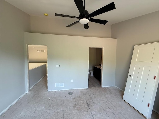 unfurnished bedroom with high vaulted ceiling, baseboards, ensuite bathroom, and ceiling fan