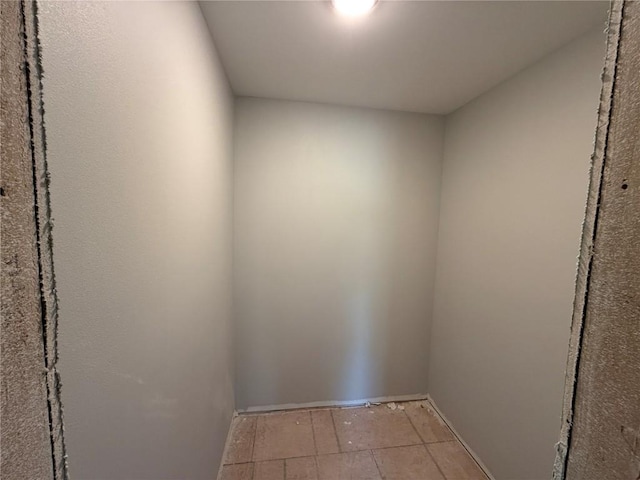 interior space featuring baseboards