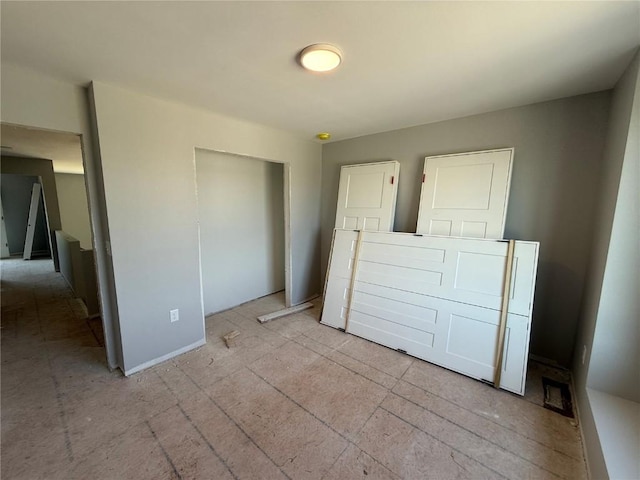 unfurnished bedroom with a closet