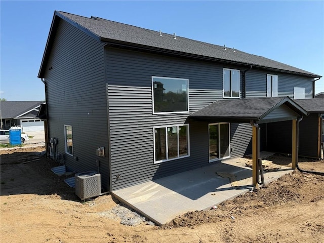 back of property featuring central AC and a patio