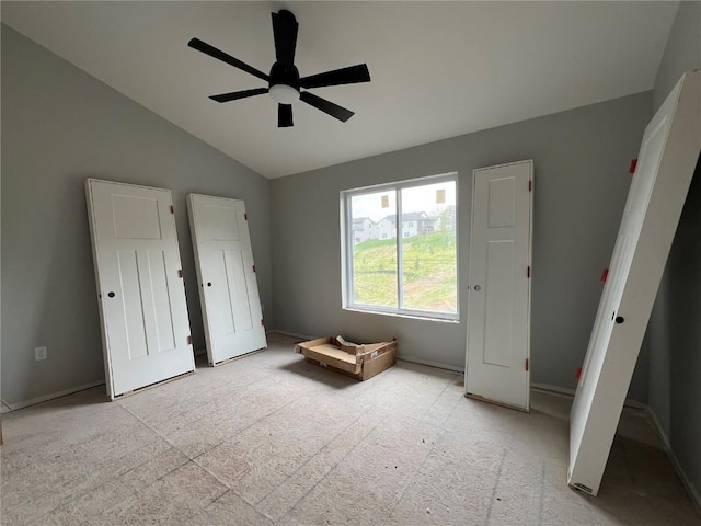 1301 Legend Dr, Tiffin, IA 52340 - bedroom with vaulted ceiling, baseboards, light carpet, and a ceiling fan