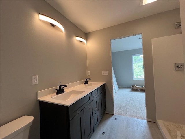 1301 Legend Dr, Tiffin, IA 52340 - bathroom featuring toilet and double vanity
