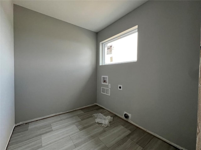 1301 Legend Dr, Tiffin, IA 52340 - laundry area featuring hookup for an electric dryer, washer hookup, and baseboards