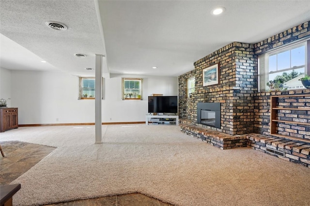 unfurnished living room featuring carpet, baseboards, a fireplace, and recessed lighting