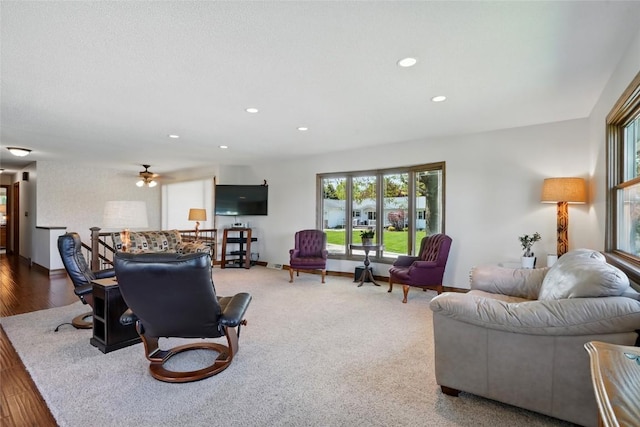 living room featuring healthy amount of natural light, baseboards, recessed lighting, ceiling fan, and wood finished floors