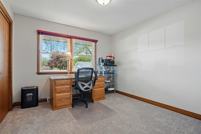 office area with light colored carpet and baseboards