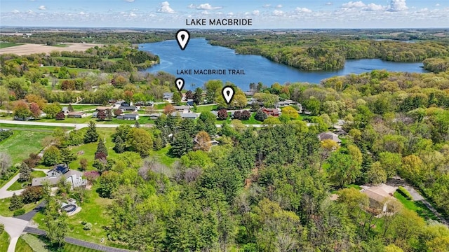 bird's eye view of a nearby body of water and a forest